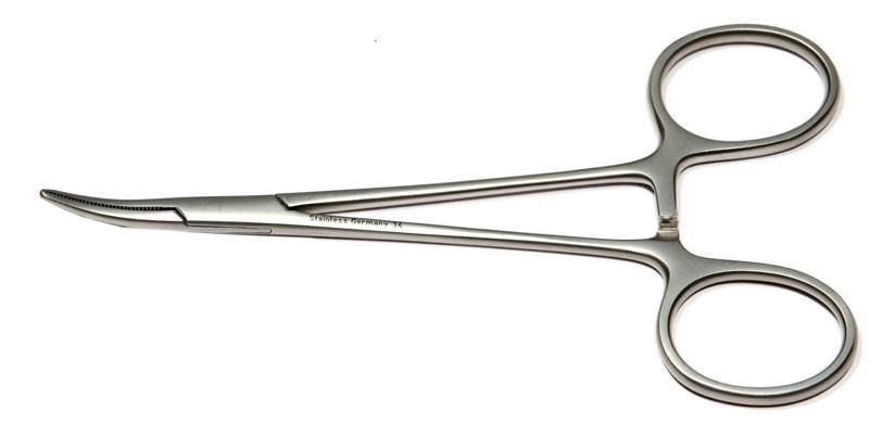 Curved hemostatic forceps in surgical setting, showing serrated jaws and ratchet lock
